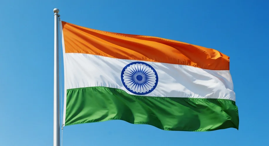 A vibrant Indian flag, featuring saffron, white, and green stripes with a blue Ashoka Chakra in the 