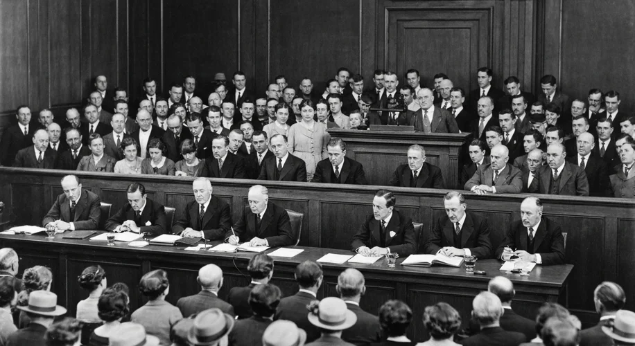 A black and white photograph depicting a crowded courtroom during the Scopes Monkey Trial, with Will